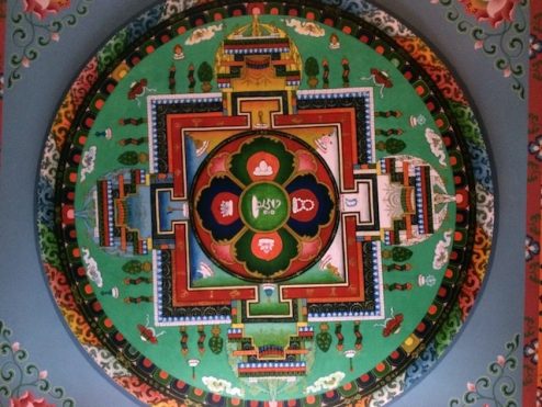 A mandala painted on the ceiling of the gompa at Tushita Meditation Centre