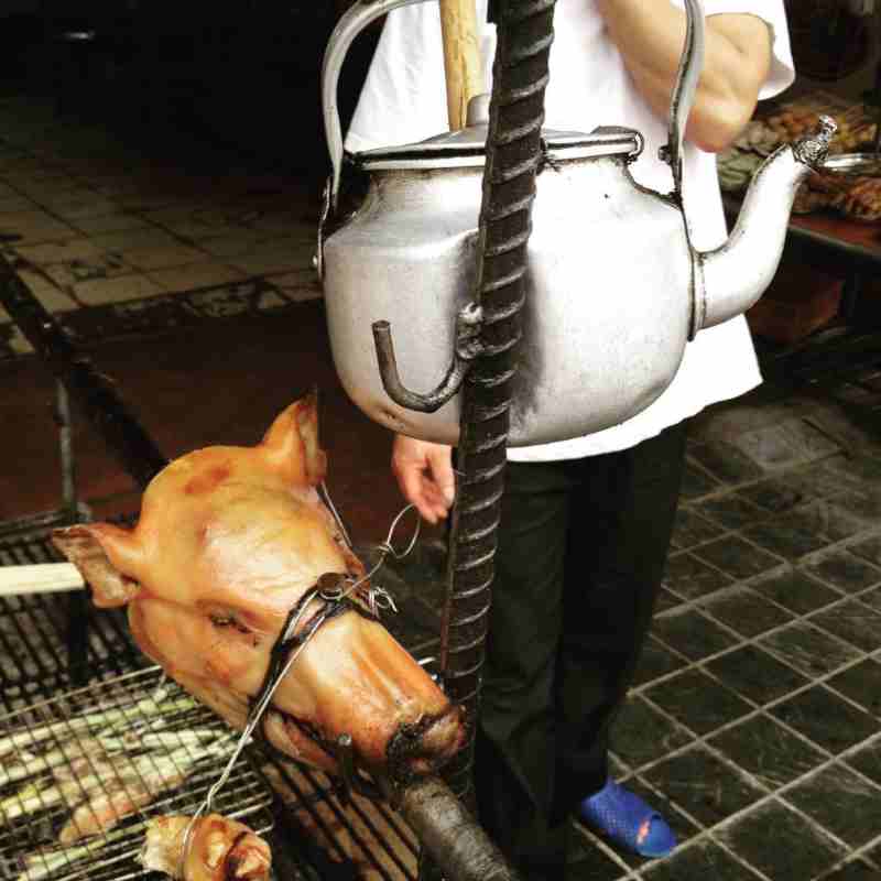 bbq pigs head in Vietnam street food market