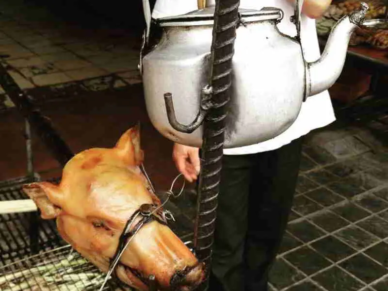 bbq pigs head in Vietnam street food market