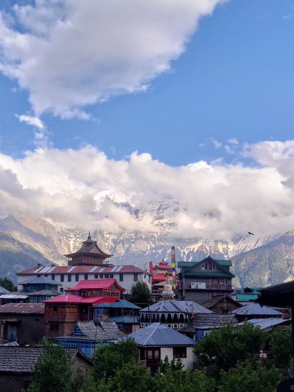 rooftops in kalpa, mountains of  spiti valley in the distance