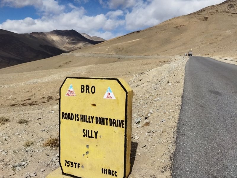 Indian road sign "road is hilly dont drive silly"