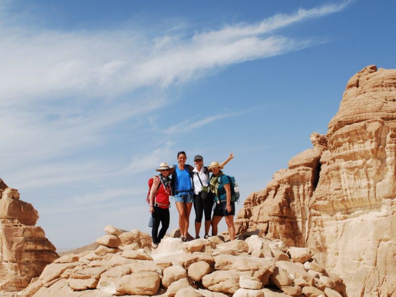 four hikers on a ridge in sinai desert during the 360 expeditions retreat