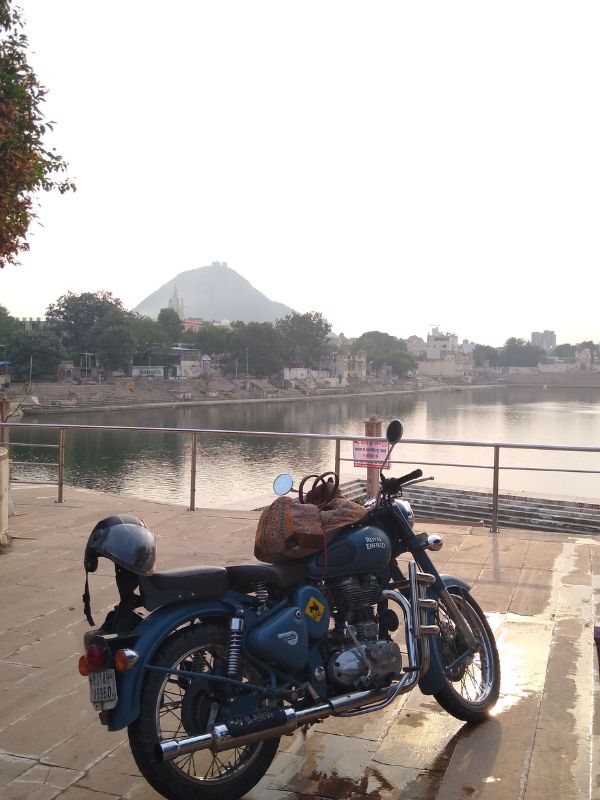 bullet 350 at pushkar lake on a road trip from jaipur