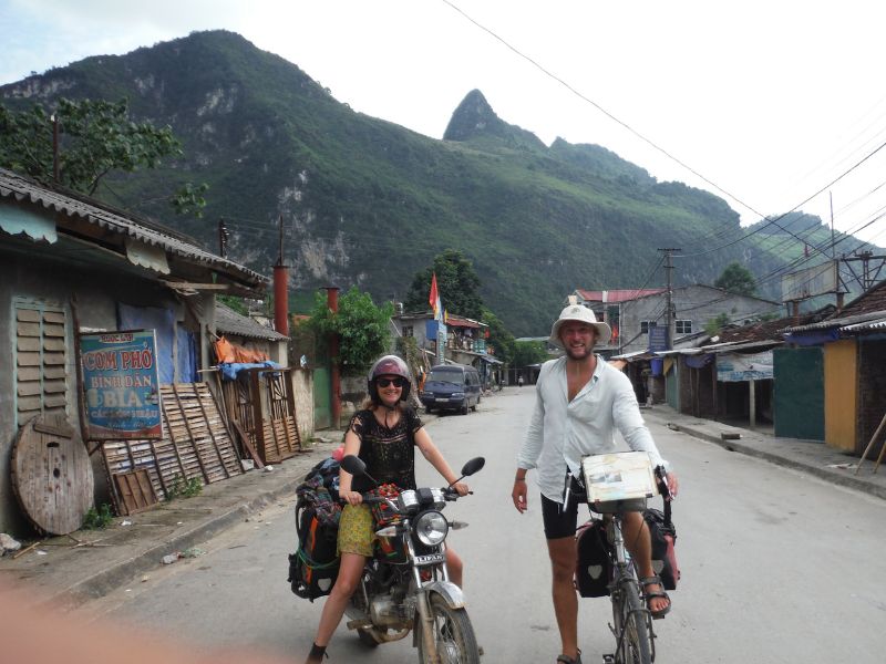bike touring companions Donna and JT in North Vietnam riding a cycle and moto